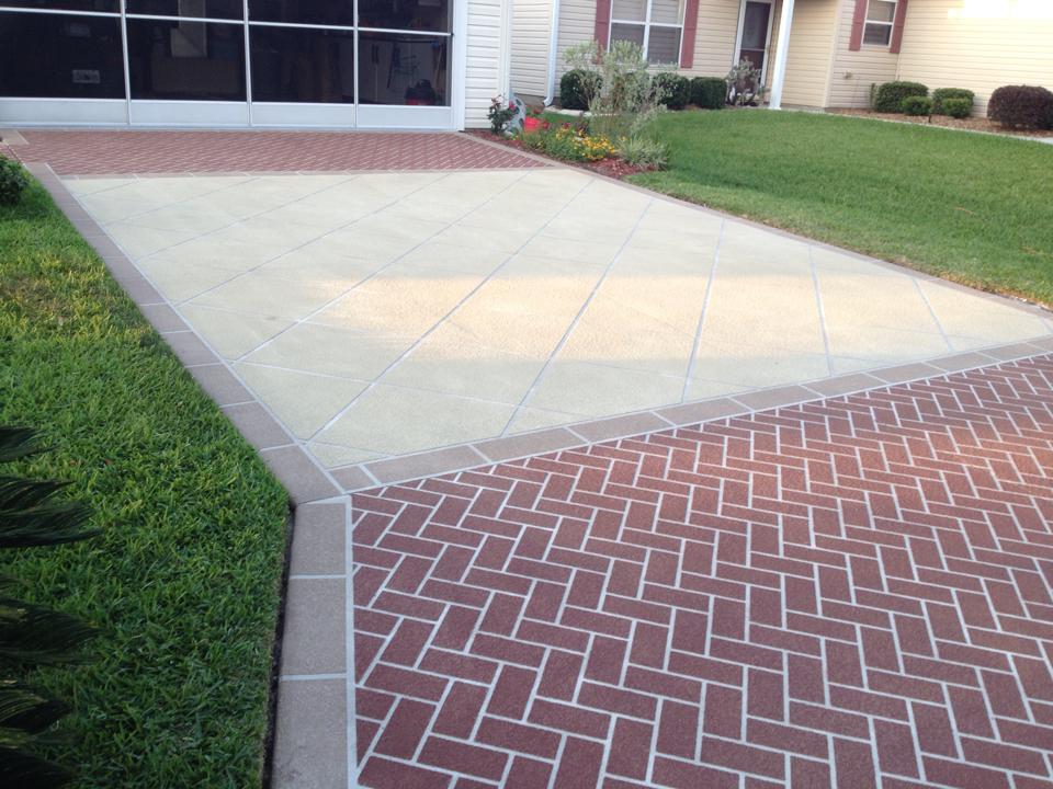 Decorative concrete overlay driveway with brick border