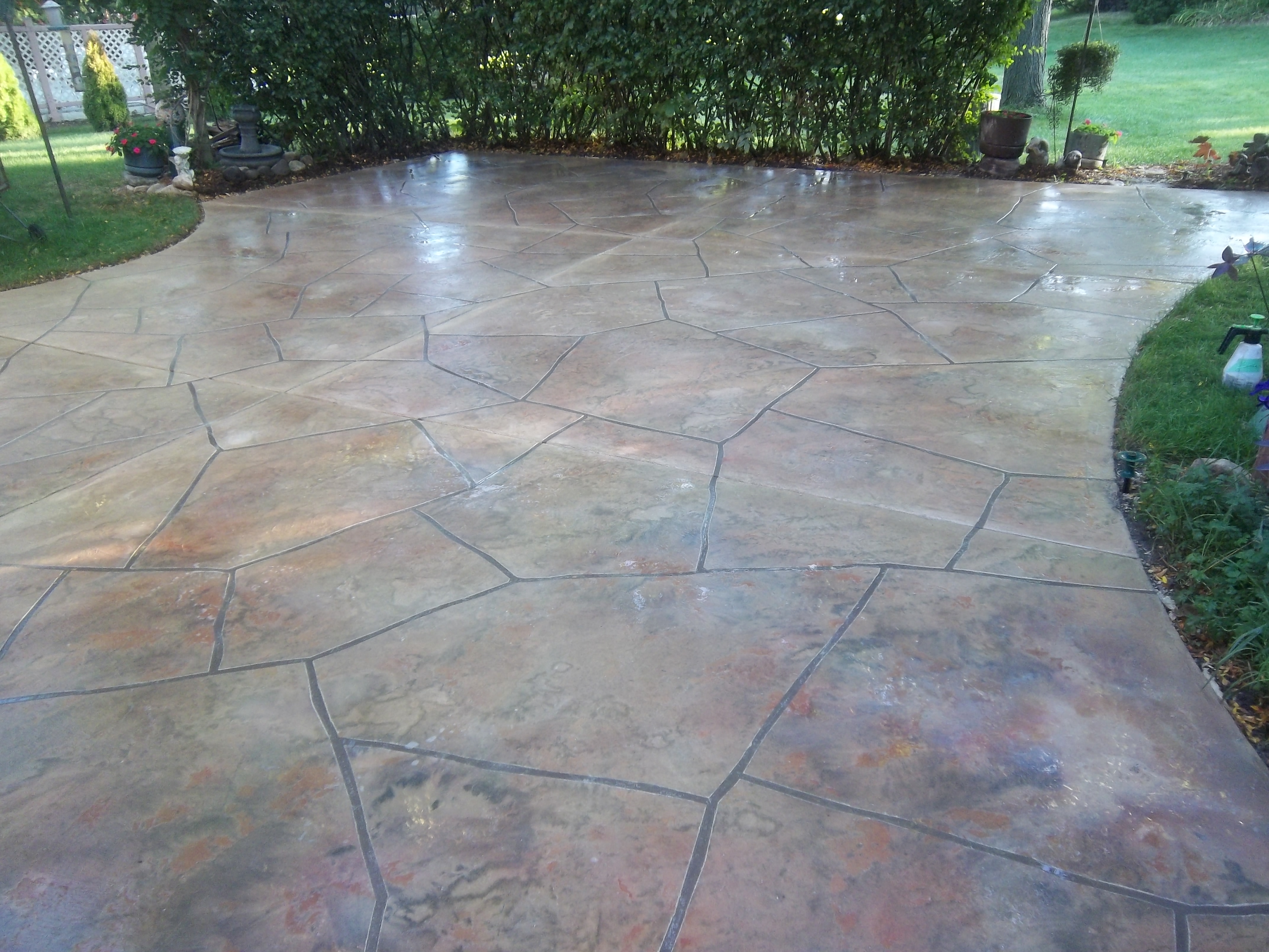 Antique-stained flagstone cementitious overlay patio