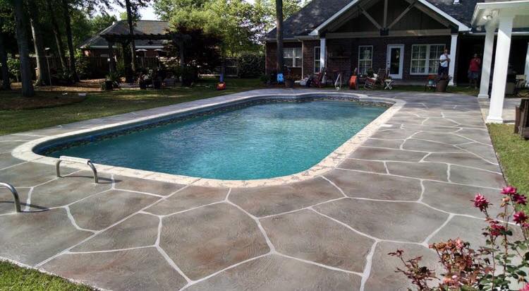 Stamped stone-textured overlay pool deck