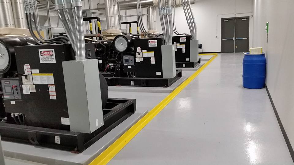 Commercial epoxy flooring installation by Armor Floor Designs