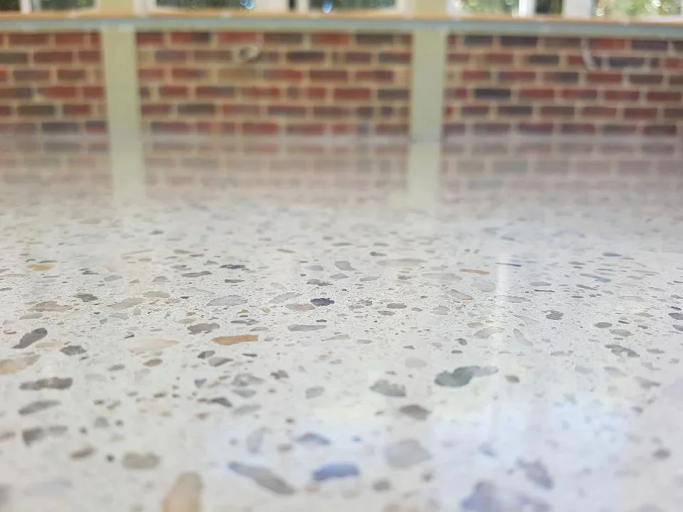 Close-up of exposed aggregate on a grind and seal floor