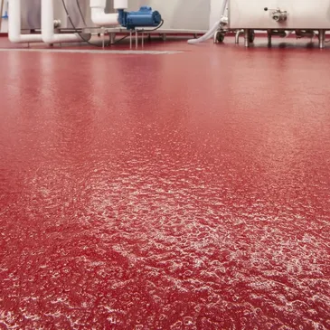 Solid red quartz floor in an industrial facility