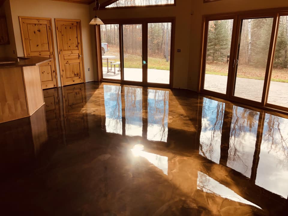 Residential epoxy flooring with metallic finish by Armor Floor Designs