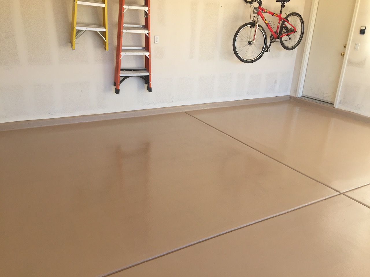 Tan solid color epoxy garage floor